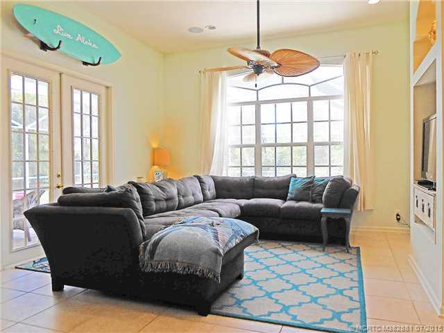 Living Room. Spacious family room with French doors to the lanai and pool.