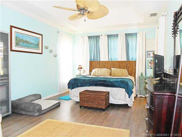 Master Bedroom. Main bedroom opens to lanai and pool.