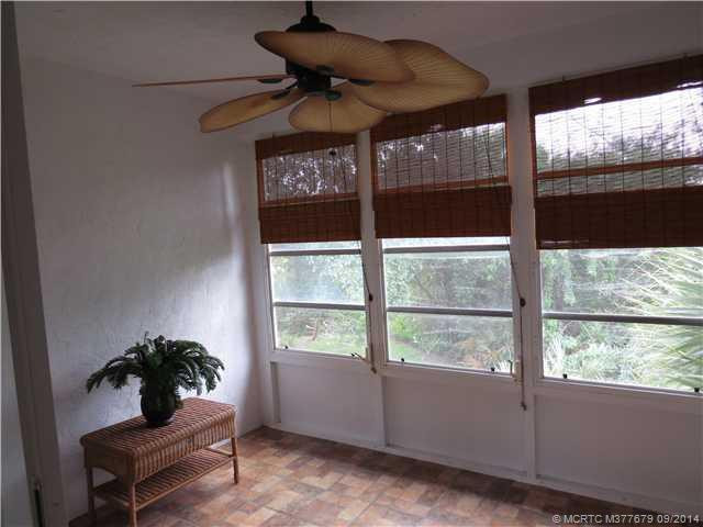 Patio/Deck. Enclosed glassed porch overlooks a wooded preserve.