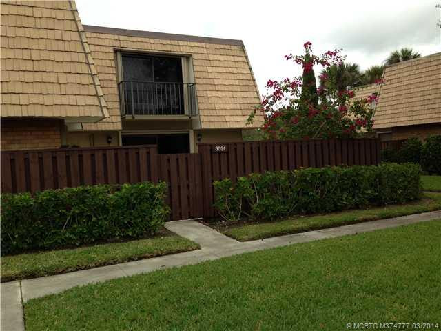 Exterior Front. Nice green area provides private views from this immaculate little quad