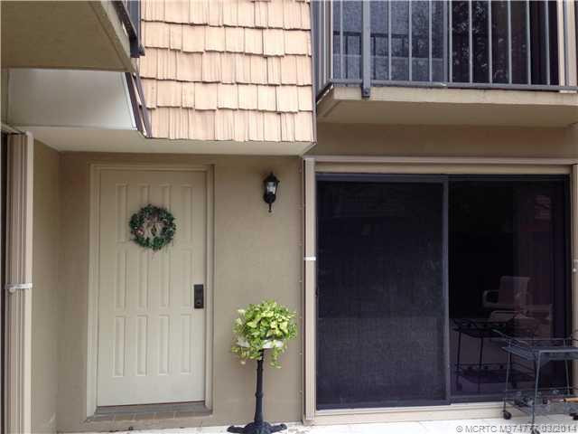 Exterior Front. accordian shutters,private fenced patio