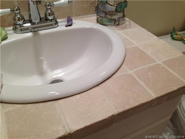 Interior Space/Layout. 1/2 bath first floor new cabinets and floor as well as tumbled marble counter
