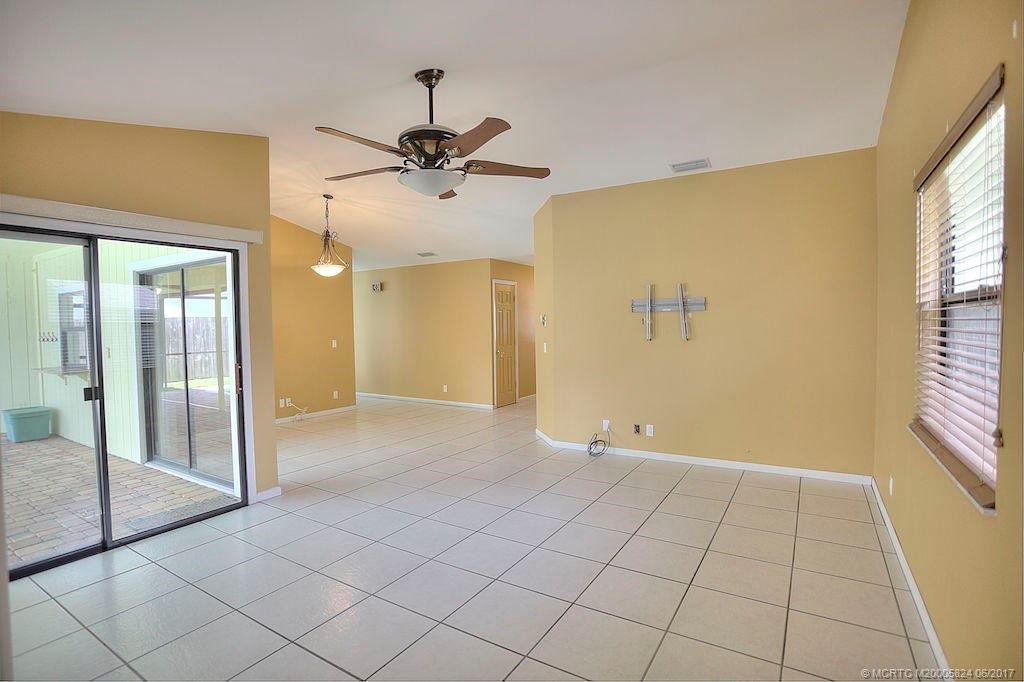 Living room with view of the Paved Patio & Beautiful Pool