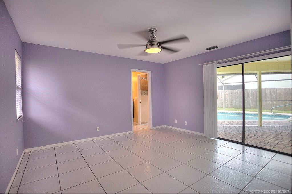 Master Bedroom with sliders to the beautiful pool