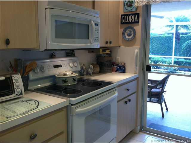 Kitchen. Kitchen is open space- plays a role as the heart of home-sliders allow access to large screened patio