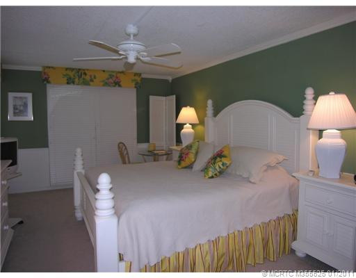 Master Bedroom. GORGEIOUS IN EVERY WAY! PANORAMIC VIEWS ACROSS THE PLANTATION FROM YOUR BAHAMA SHUTTERED WINDOW AND SLIDING DOORS TO THE PORCH!