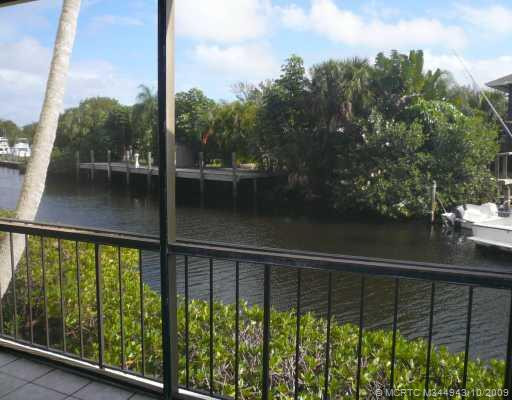 View. Look down the wide waterway from the screened patio and see boats coming and going