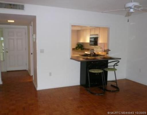 Other. Entry foyer leads to renovated kitchen with breakfast bar and large, open living/dining area