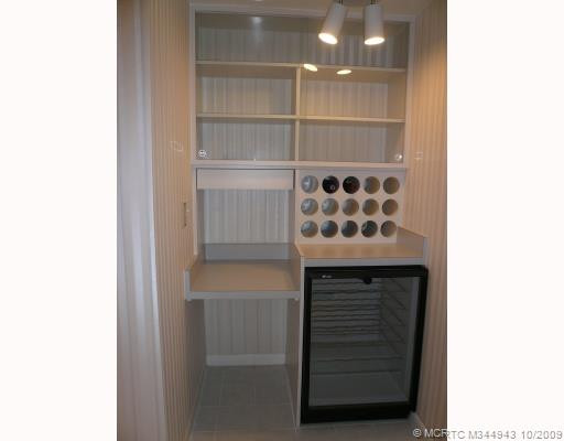 Other. Built-in wine rack and beverage cooler with home office space