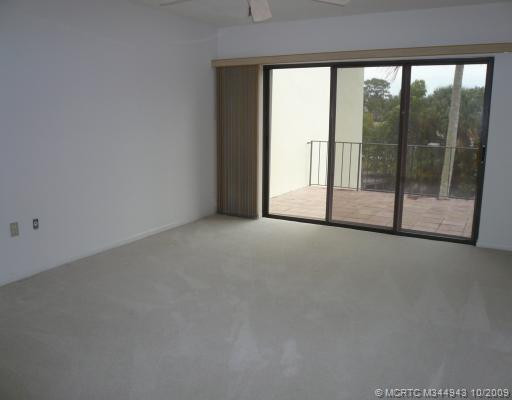 Master Bedroom. Large MBR has open balcony through sliders - w/accordion shutters, ceiling fans throughout