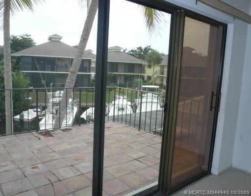 Patio/Deck. Patio off Master Bedroom grants a breezy, sunny view of boats and water
