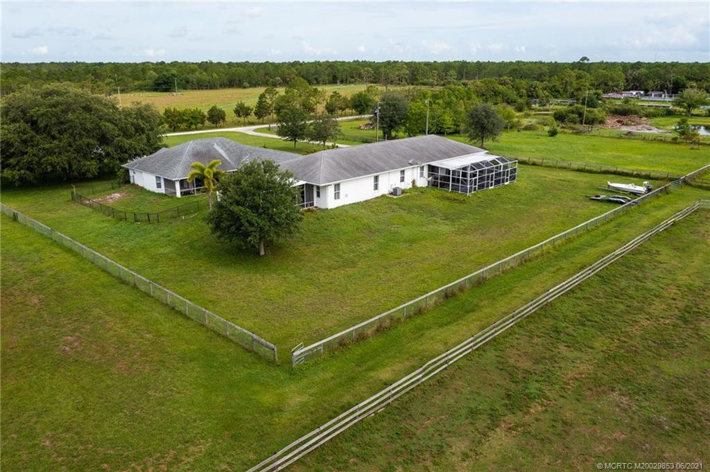 Rear of home(s)- on left is main house on right is attached 2/1 apartment
