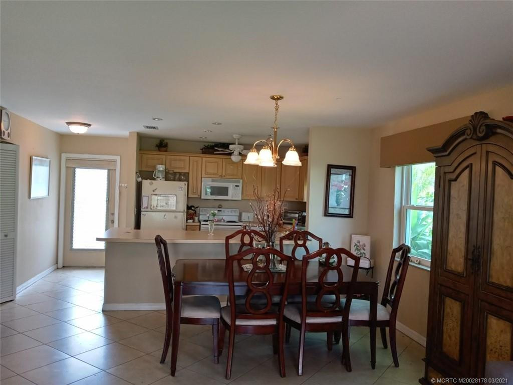 Living area looking back to dining area, kitchen and front entrance
