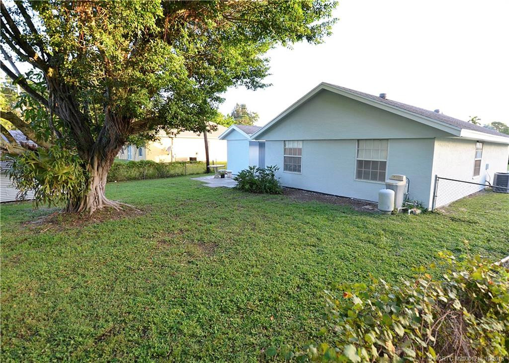Exterior Rear with fenced in back yard.