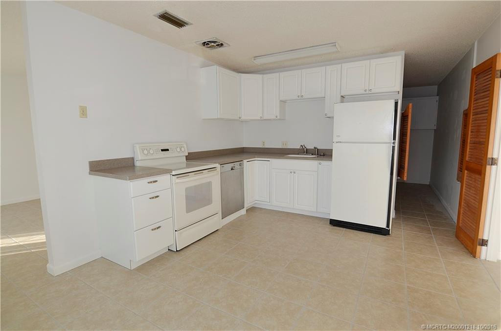 Kitchen with utility room off the side. Very spacious with eat in kitchen.