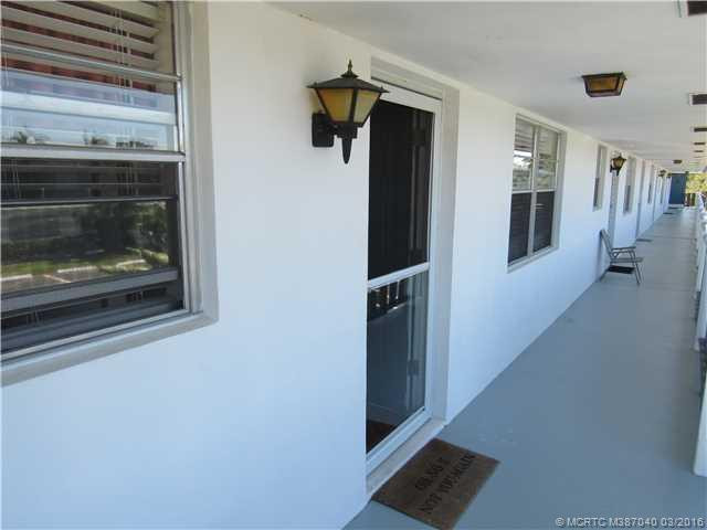 Exterior Front. Storm door at entry