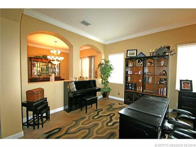 Exterior Front. Formal living room opens to the dining room with arched cut outs