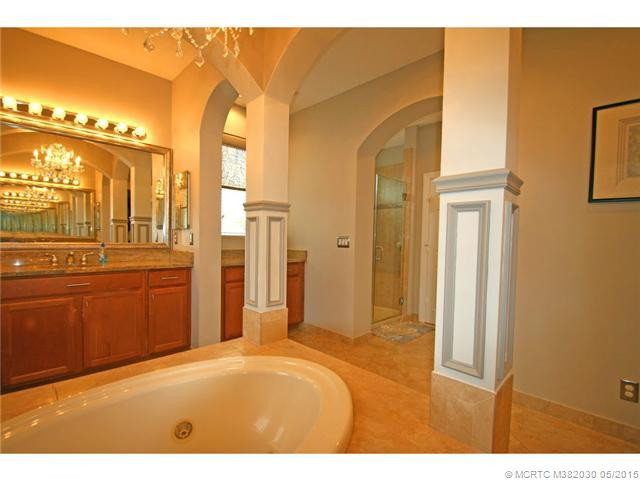 Exterior Front. Spa like master bath with large jetted tub and columns