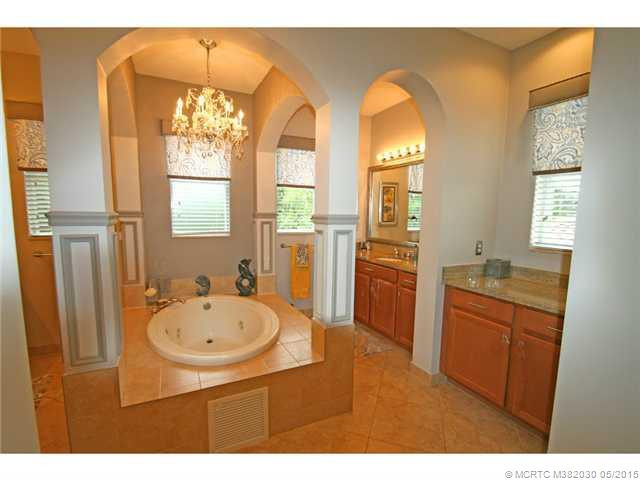 Exterior Front. Spa like master bath with large jetted tub and columns