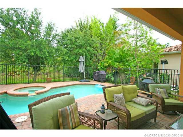 Exterior Front. Covered patio opens to the private pool and spa on the quiet preserve lot.