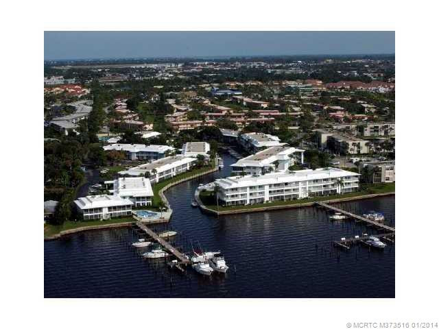 Exterior Front. Spectacular Million Dollar View from the enclosed balcony. Building on left as you view this picture. Prime End unit... DOCK included