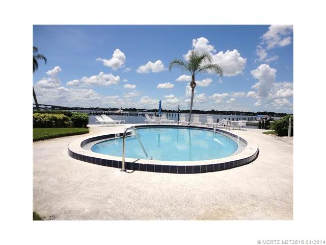 Exterior Front. One of the three pools enjoyed by the residents of Windjammer. Overlooks the St. Lucie River