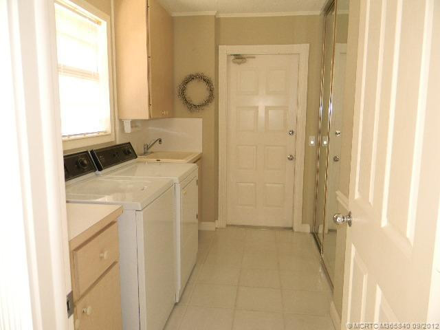 Other. Large, bright Laundry room with sink and plenty of storage makes that chore a pleasant one!