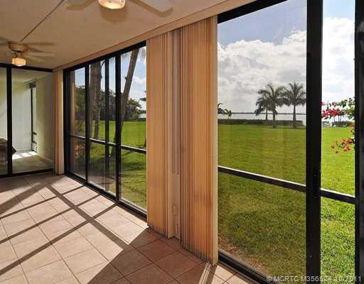 Patio/Deck. This Patio/Florida Room is completely enclosed with screen and sliding glass doors. A Great view of the Indian River with beautiful sunsets and yard.