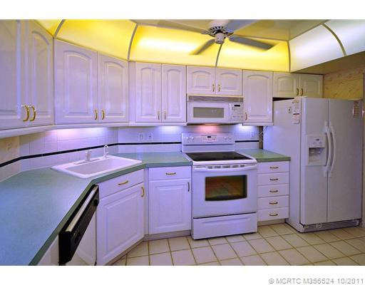 Kitchen. Newer Applainces, and countertops with nice cabinets.