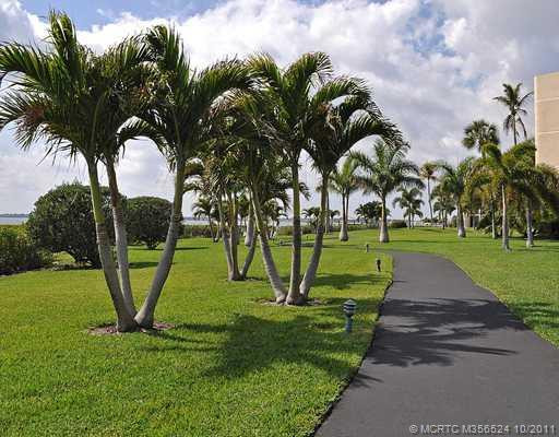 Exterior Front. Walk way on the river in front of the Florida room