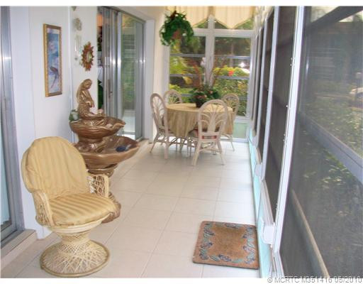 Patio/Deck. glassed-in tiled porch