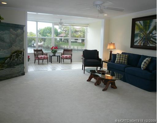 Living Room. Wide Living Room with panoramic view of lagoon - freshly painted & carpeted, new ceiling fan