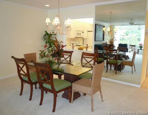 Dining Room. Mirrored wall in Dining Room reflects the light and view from the water