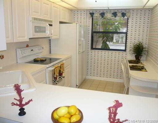 Kitchen. Eat-In Kitchen is cheery in all white
