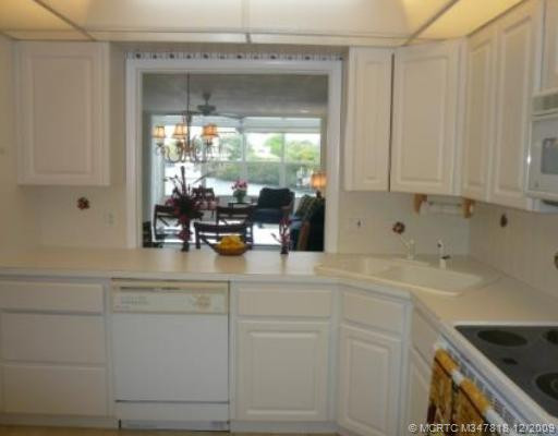 Kitchen. Lots of cabinet and counter space, all fresh and white