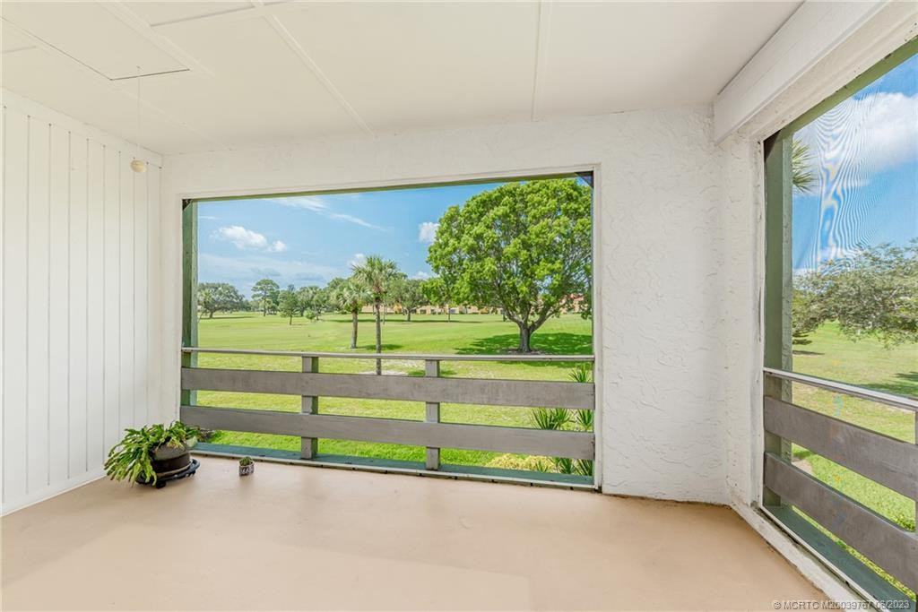 Enjoy the large oak tree that frames the screened patio