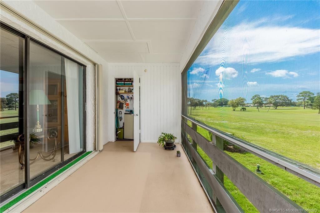 Screened patio catches the breezes off the Intracoastal waterway just over the tree line. Nice large storage closet to hold your clubs, rods, beach chairs....you know all the tools you will need everyday!