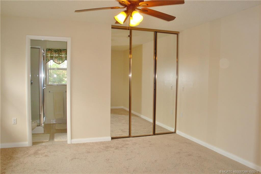 Master Bedroom with walk-in closet & new carpeting.