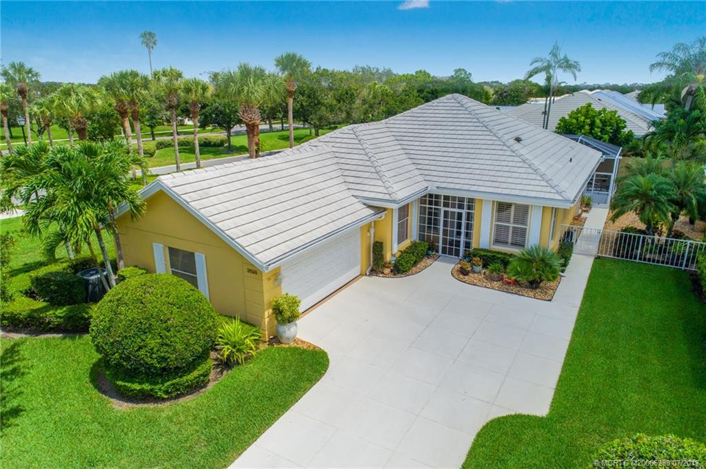 Pride of Ownership shows in every detail! Beautifully manicured grounds with tropical plantings & lush Lawn.