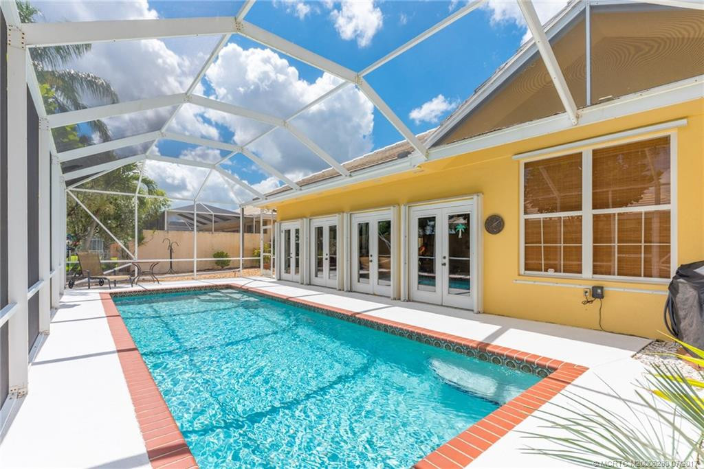 Enjoy swimming and sunning in the resort style pool with screened patio & lovely pool deck.