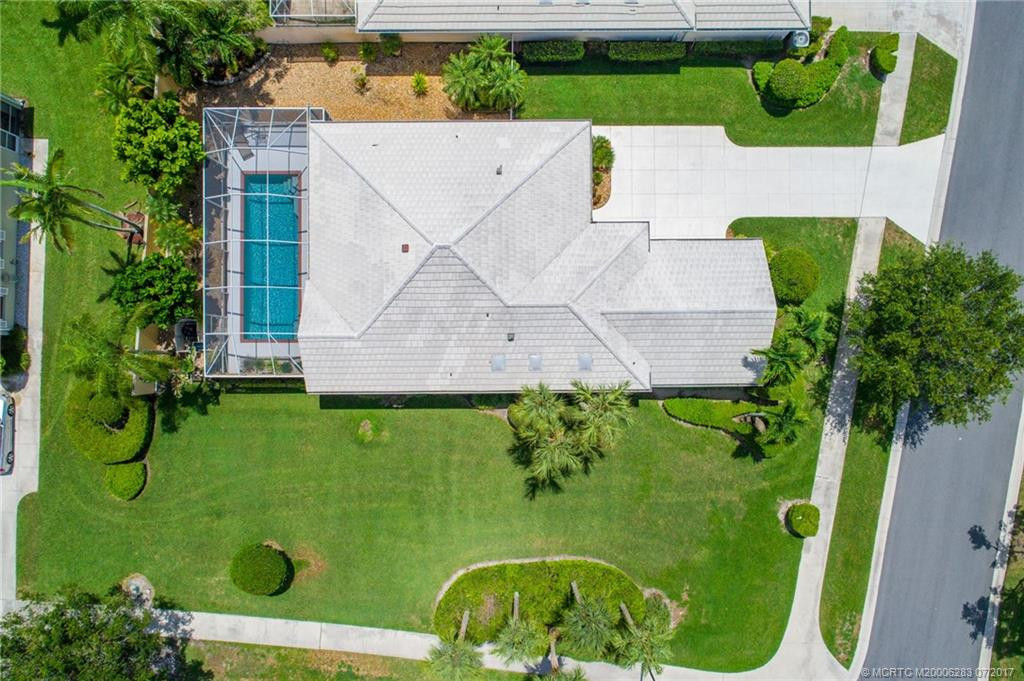 Gorgeous corner lot with tropical plantings.