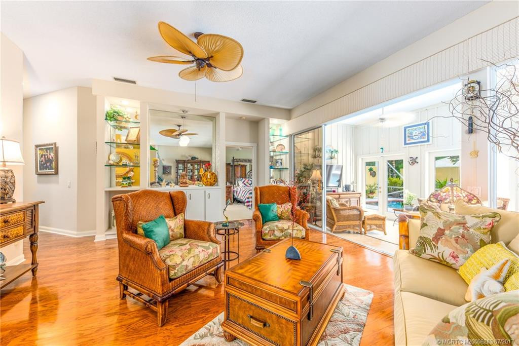 A great gathering space with views of the pool & sunny Florida Room!