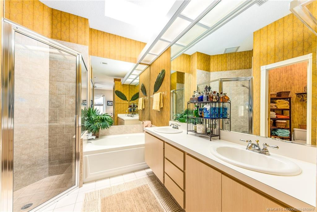 Master Bath with walk in shower, skylight, soaking tub, separate water closet, dual vanities & plenty of storage!!