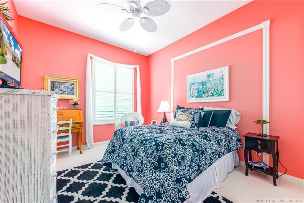 3rd Bedroom with plantation Shutters, ceiling Fan, upgraded carpeting & custom paint.