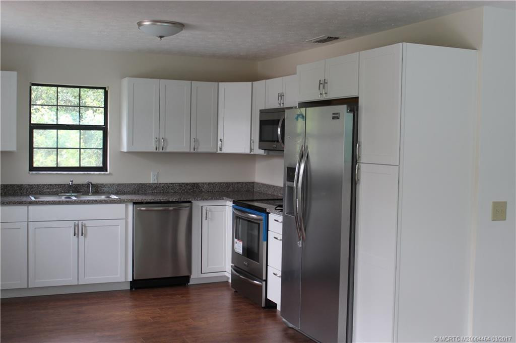 Kitchen with new appliances and granite counters