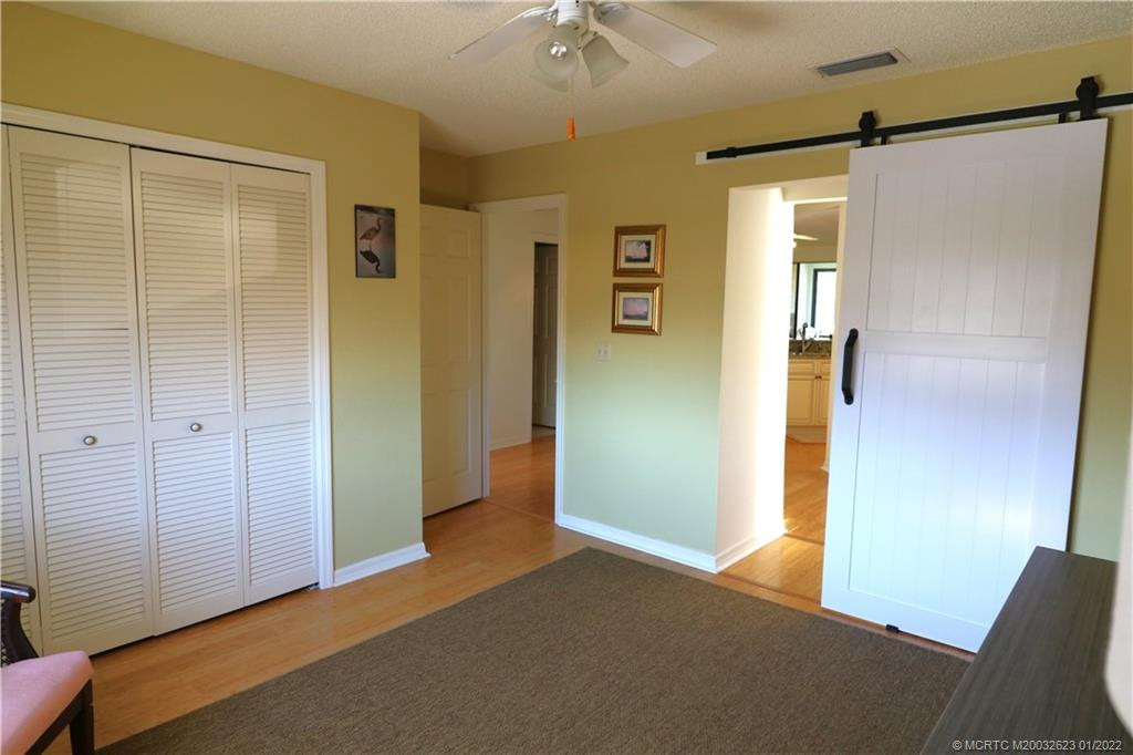 Barn door leading into 3rd bedroom