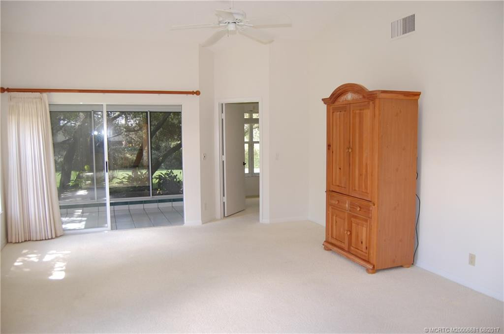 Living room view out to patio with sliding glass doors.