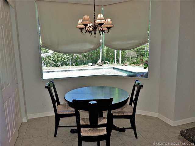 Kitchen. Breakfast Nook With Frameless Window Looking To Pool & Yard