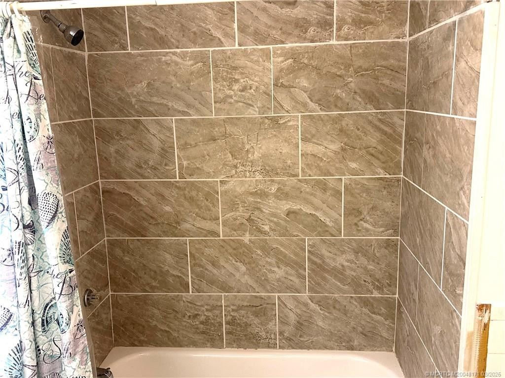 Newer tile in Guest BathTub/shower combo