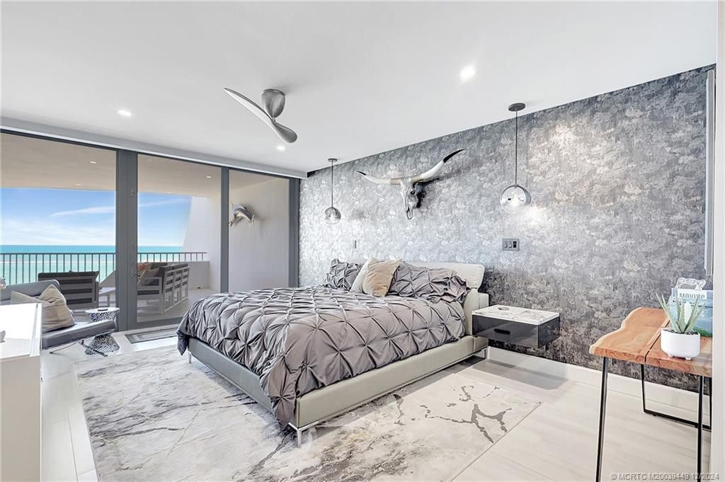 Primary suite has ocean view and sliders to the balcony, perfect for that morning cup of coffee